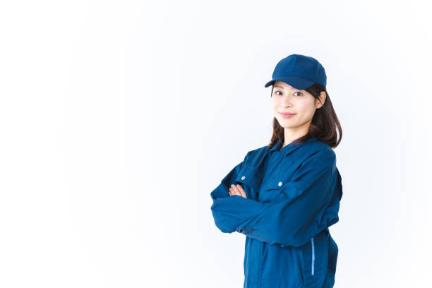 istock Young woman working in work clothes with a smile on her face 1410601912