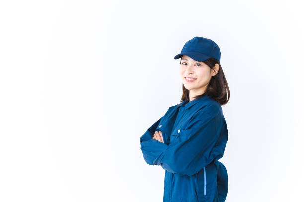 istock Young woman working in work clothes with a smile on her face 1410601923