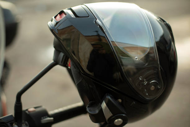 istock Motorcyclist helmet. Black helmet on motorcycle. Security tool. 1410603932