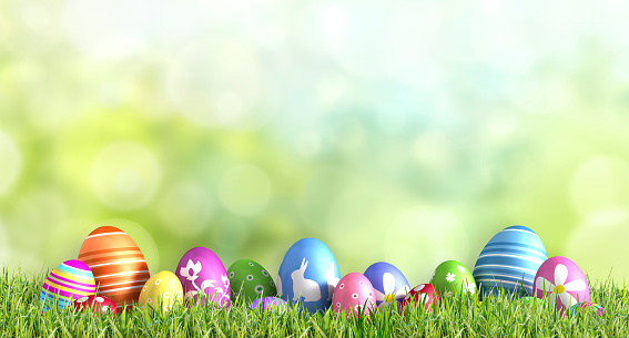 Row of painted colored Easter eggs in green grass with spring background - 3D illustration