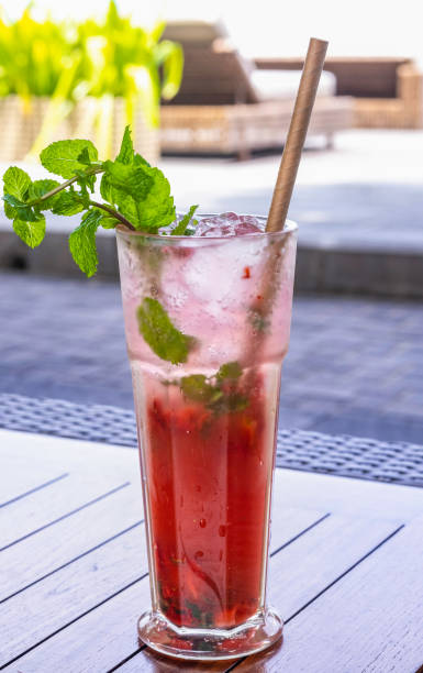 istock Tropical red cocktail with fresh mint and straw 1410605768