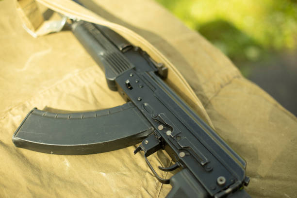 istock Automatic weapon parts. Barrel of machine gun. Training weapon is on table. 1410608427