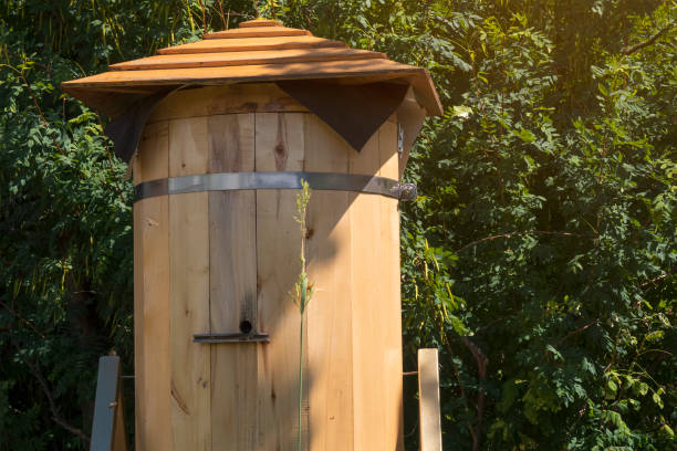 istock Wooden beehive closeup on sunny day. Apiculture. 1410608455