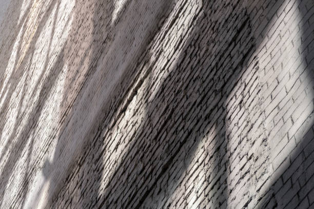 istock Old brick wall plastered with highlights from other buildings. Background image. 1410608661