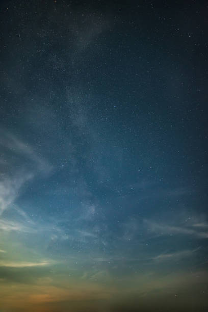 istock Beautiful noctilucent cloud formations against Milky Way background night sky 1410608793