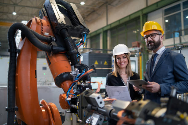 istock Female engineering manager and mechanic worker doing routine check up in industrial factory 1410610191