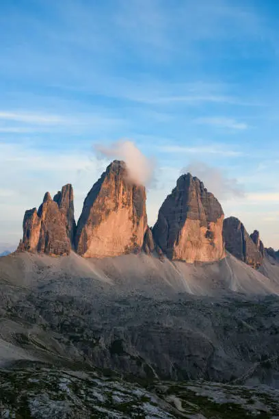 Photo of Stunning view of the Three Peaks of Lavaredo, (Tre cime di Lavaredo) during a beautiful sunset. The Three Peaks of Lavaredo are the undisputed symbol of the Dolomites, Italy.