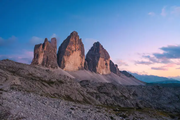 Photo of Stunning view of the Three Peaks of Lavaredo, (Tre cime di Lavaredo) during a beautiful sunset. The Three Peaks of Lavaredo are the undisputed symbol of the Dolomites, Italy.