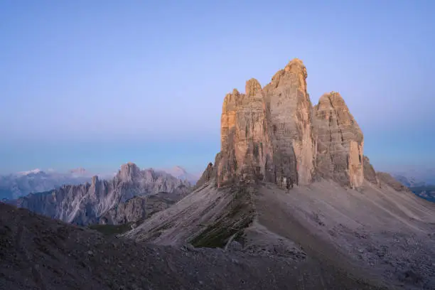 Photo of Stunning view of the Three Peaks of Lavaredo, (Tre cime di Lavaredo) during a beautiful sunrise. The Three Peaks of Lavaredo are the undisputed symbol of the Dolomites, Italy.