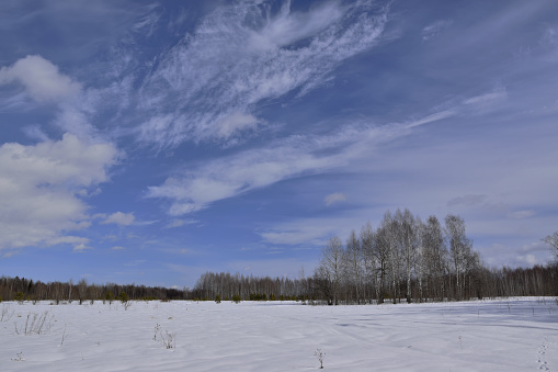 Panoramas and views of the Ural nature during the active spring snowmelt. The frequent alternation of thaw and frost forms a crust on the snow cover, which in frosty weather acts as an asphalt cover