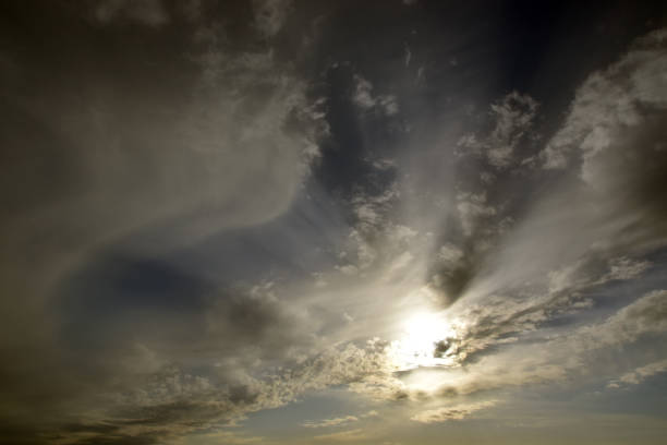istock The sun in the sky covered with light clouds 1410611935
