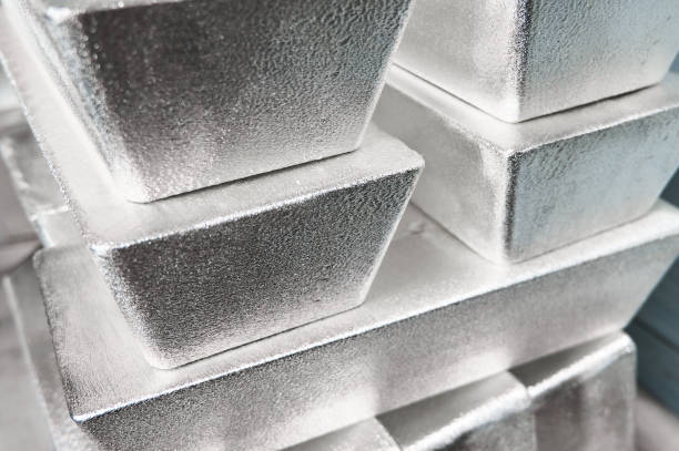 istock Pile of industrial silver bars at bright light in storage 1410614307