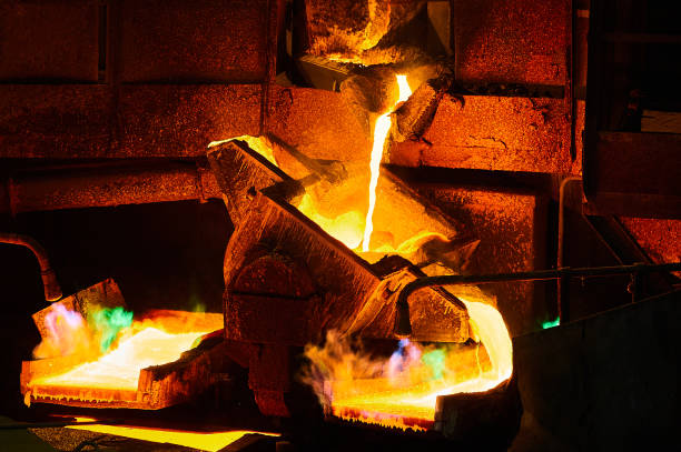 istock Pouring liquid copper metal for anodes into form in workshop 1410614453