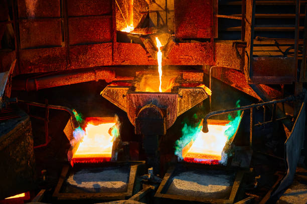 istock Pouring liquid copper metal for anodes into form in workshop 1410614485