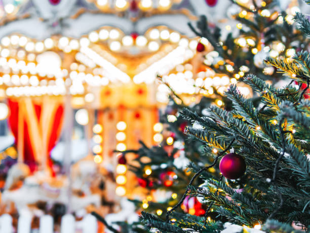 istock Christmas tree, blurred carousel merry go round 1410614916