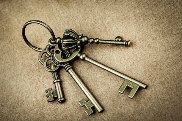 istock image of old key paper background 1410617619