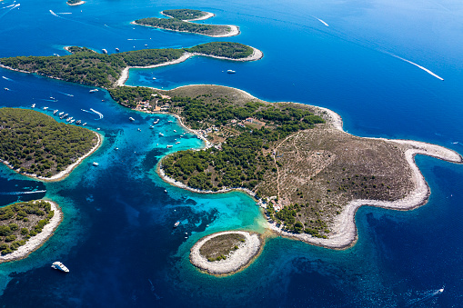 Pakleni or Paklinski, islands with all their amazing bays and incredible shades of blue and emerald colors seen from a different perspective and captured from a helicopter during one summer day in Croatia.