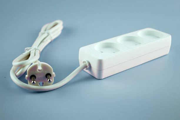 istock white electric extension cord on blue background 1410621585