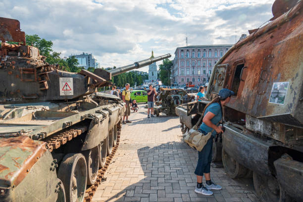 2022-07-21 Kyiv, Ukraine. Ukrainian citizens look at the destroyed russian warfare stock photo
