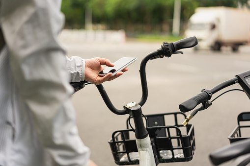 Man is using mobile phone scan to pay for shared bike