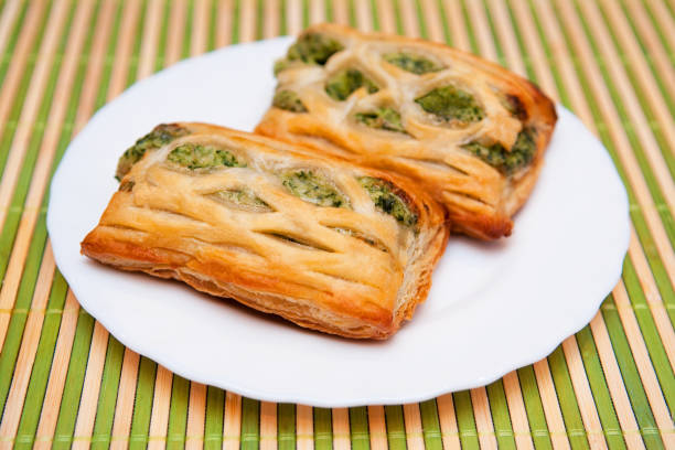 istock Two snacks made of french pastry and spinach 1410636895