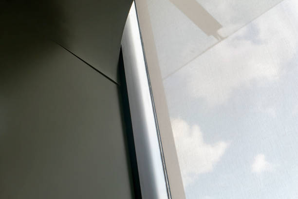 istock Blue sky and white clouds outside the window with the curtains drawn 1410638171
