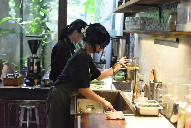istock Vietnamese waitress getting ready an order in a coffee shop 1410638697