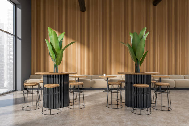 istock Modern cafe interior with sofa and bar chairs, eating space and panoramic window 1410639950