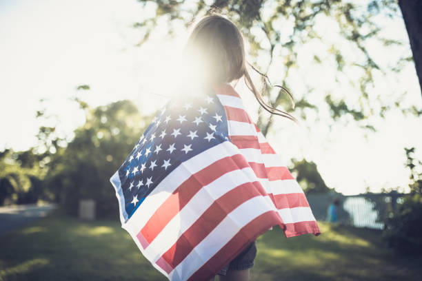 istock Proud little american girl 1410640083