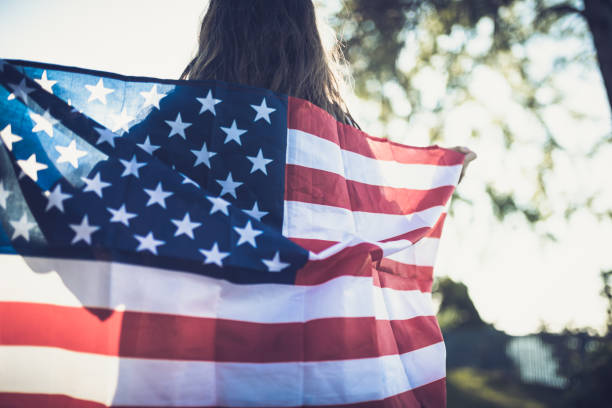 istock Patriotic Girl Flying American Flag, 1410640196