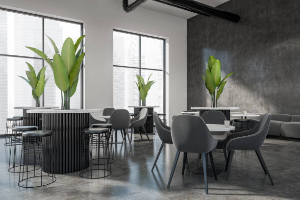 istock Stylish cafe interior with table and chairs, eating area and panoramic window 1410640627