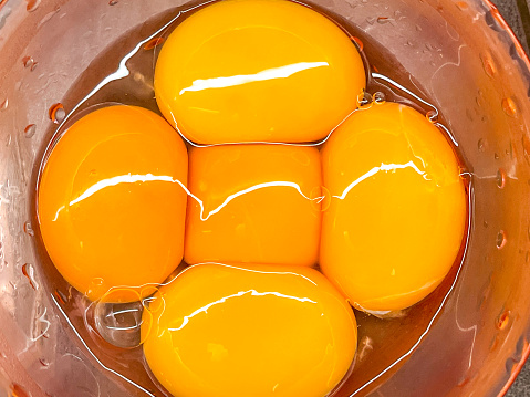 Fresh broken egg yolks