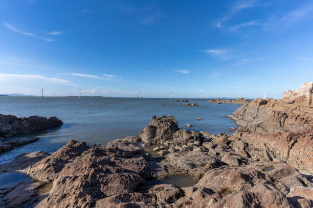Afternoon coastline and offshore wind turbines
