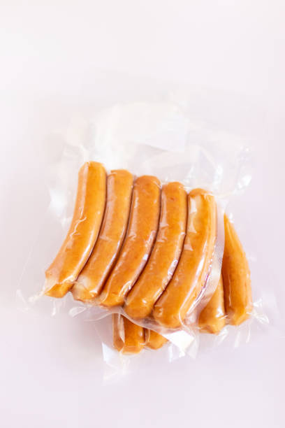 Chicken sausage in vacuum package isolated on white background. stock photo