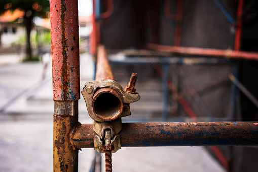 Scaffolding, close up of poles joined together.