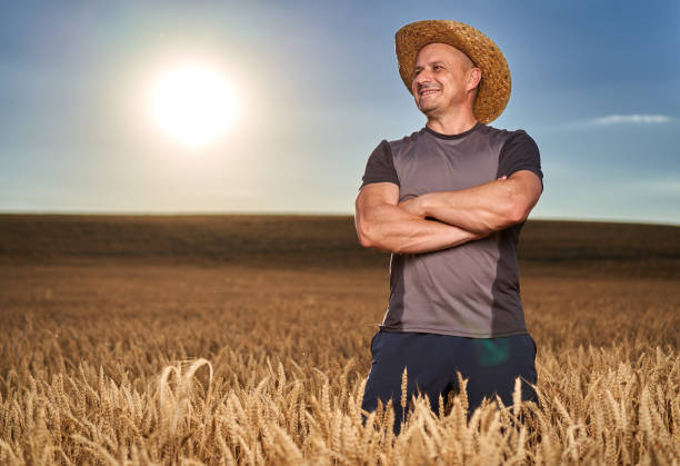 istock Happy farmer in a wheat field 1410648176