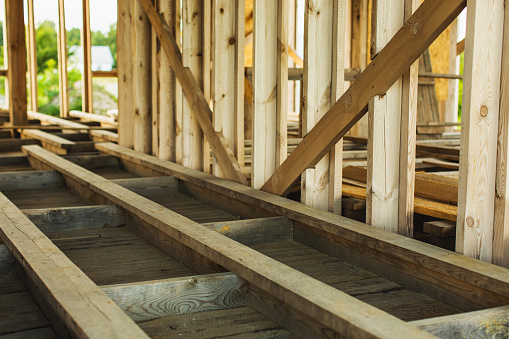 Lay wooden floor. Building house. Construction materials. Wood. House frame. Timber