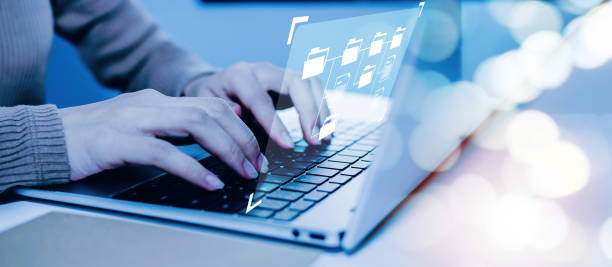 istock business woman using laptop computer with virtual graphic icon on desk at home office, document management, digital marketing, work from home, business finance, internet network technology concept 1410648922