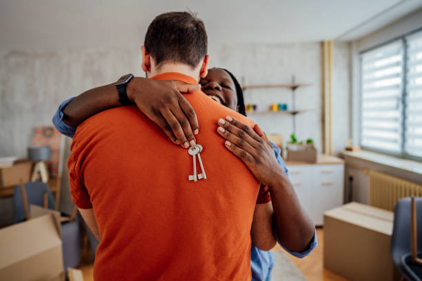 istock Young couple with keys from the new apartment 1410651932