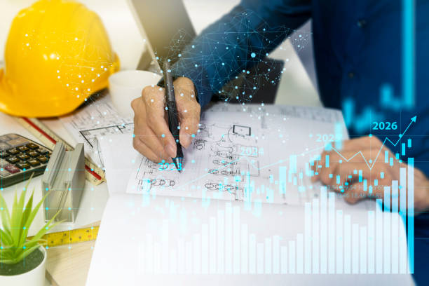 istock Profit generation and construction business growth,Building projects, construction drawings and engineers 1410651986