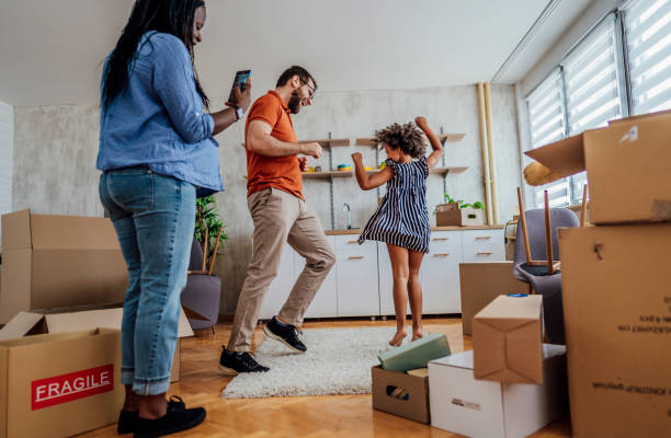 istock Excited family celebrating moving day 1410652679