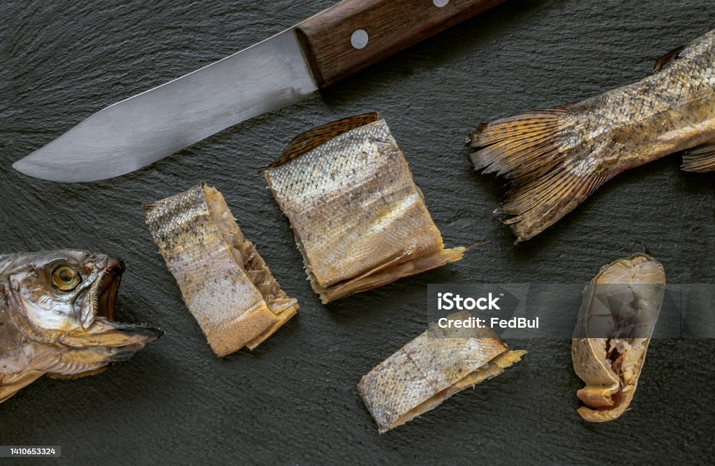 Sliced Smoked Fish Knife On Blackstone Kitchen Plate Dried Kippered Trout  Fish Stock Photo - Download Image Now - iStock
