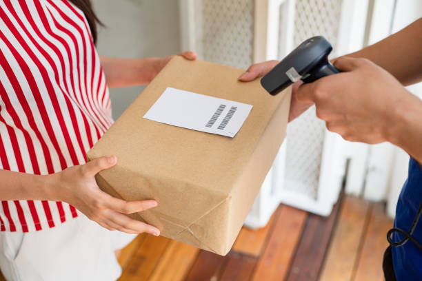 istock Woman brings parcels to the post office. 1410654830