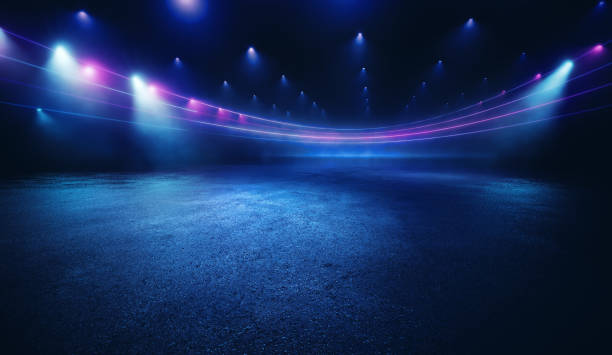 Illuminated dark concrete surface surrounded by modern neon colour lights