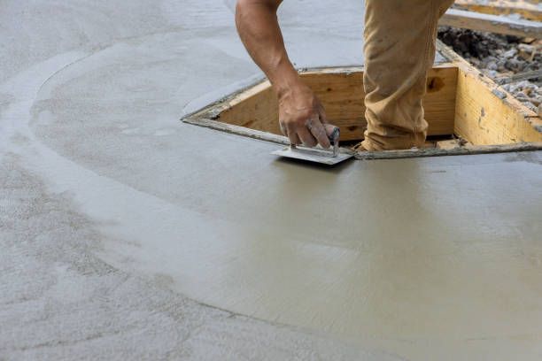 istock A construction worker using stainless steel edger on wet cement forming corner to new cement floor 1410656791