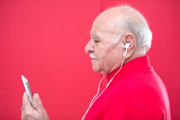 Senior Man portrait on red background