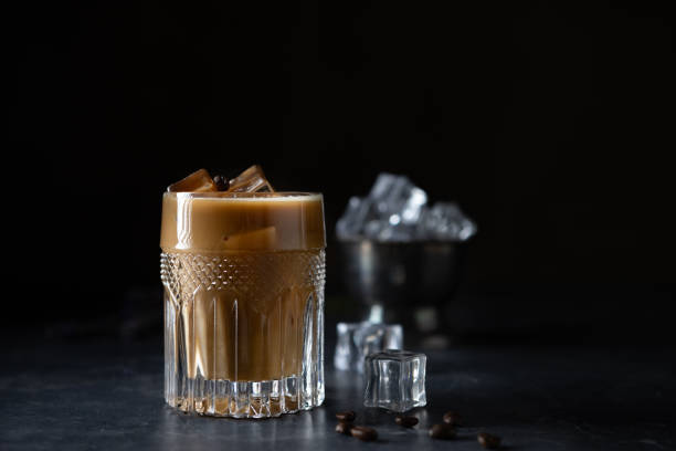 istock Glass cold brew coffee with ice and milk on black or dark background. 1410661938
