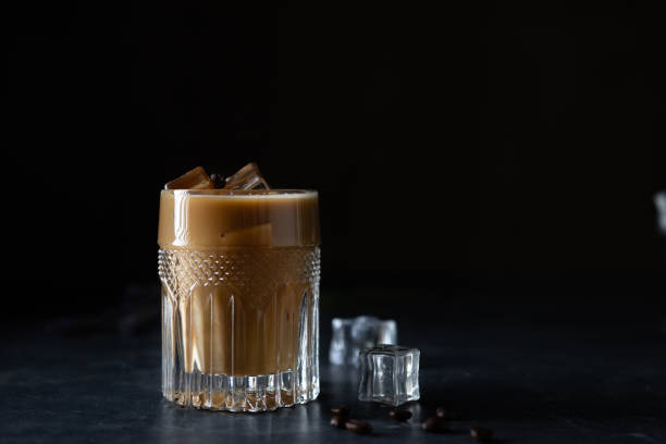 istock Glass cold brew coffee with ice and milk on black or dark background. 1410661946