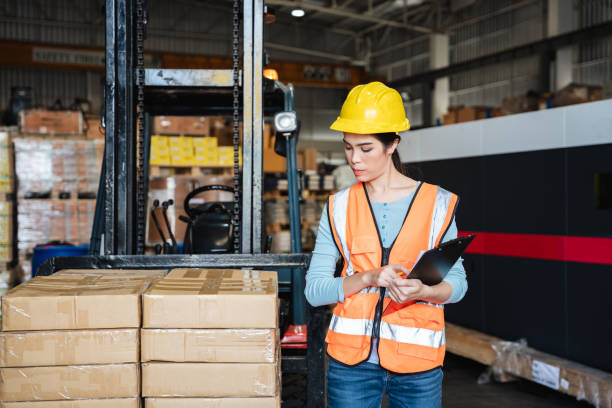 istock Warehouse worker checking the quantity of storage products on the shelf  in the warehouse., Industrial and industrial concept. 1410665123