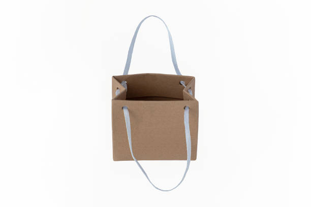 istock Paper bag on a white background. Retail trade. Consumerism 1410665421